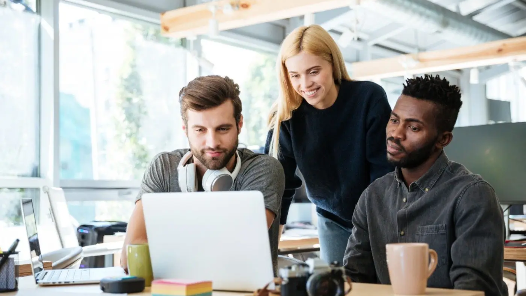 demo-attachment-2719-happy-colleagues-sitting-in-office-coworking-PHYA6TG