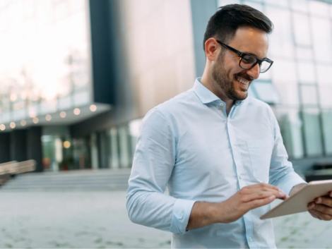 demo-attachment-2721-portrait-of-businessman-in-glasses-holding-tablet-AWVHCJU